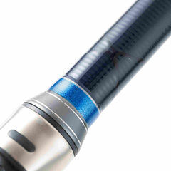 Close-up of blue and carbon fiber Mojo Muscle X Power surfcasting rod handle with metal reel seat