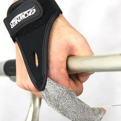 Hand wearing black Owner single finger surfcasting glove gripping a fishing rod handle for surf fishing in New Zealand